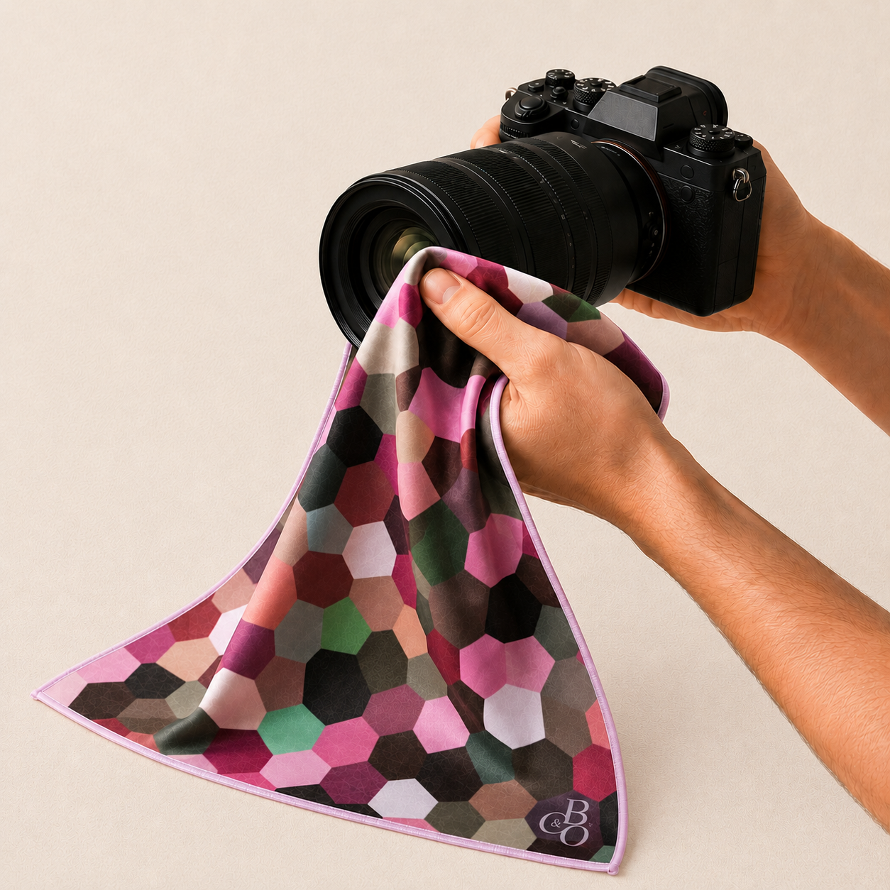 Maple cloth being used with a camera lens