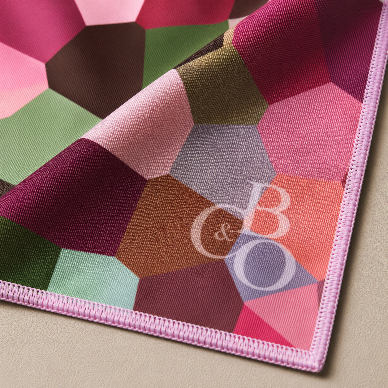 Close detail of Maple microfibre, stitched edge and printed mark