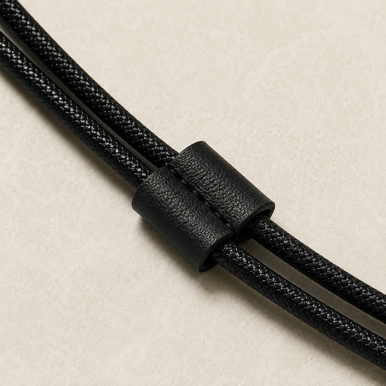 Close view of the rear length adjuster and braided cord