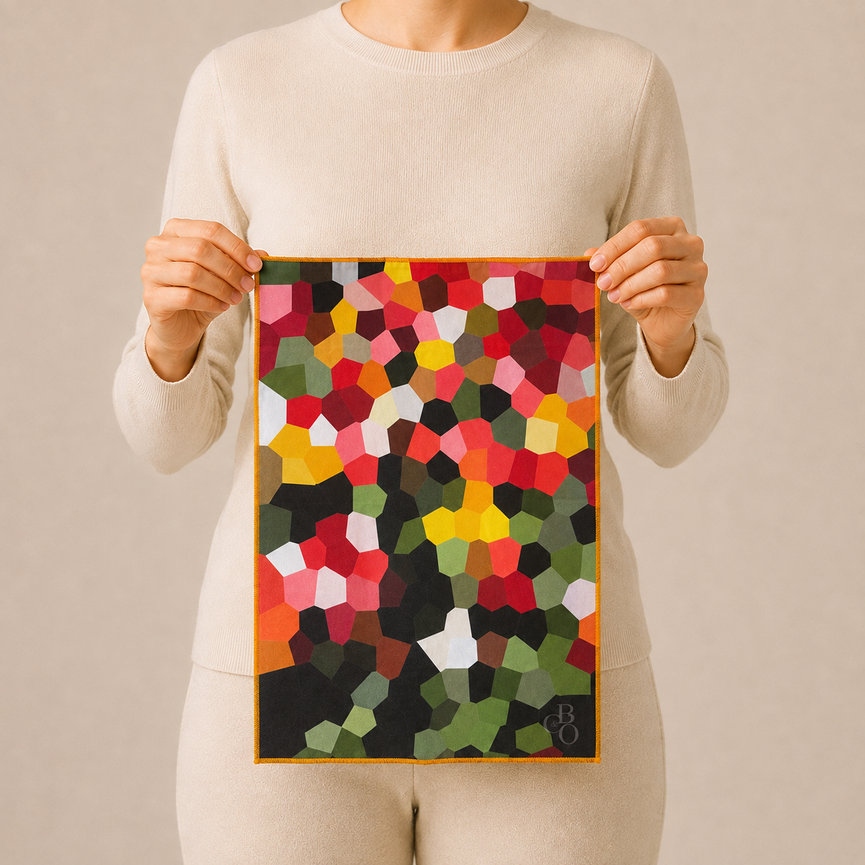 Person holding the oversized Blossom of Colour cloth to show its scale