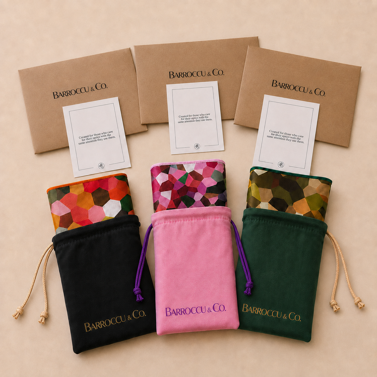 Three cloths with matching pouches, envelopes and care cards