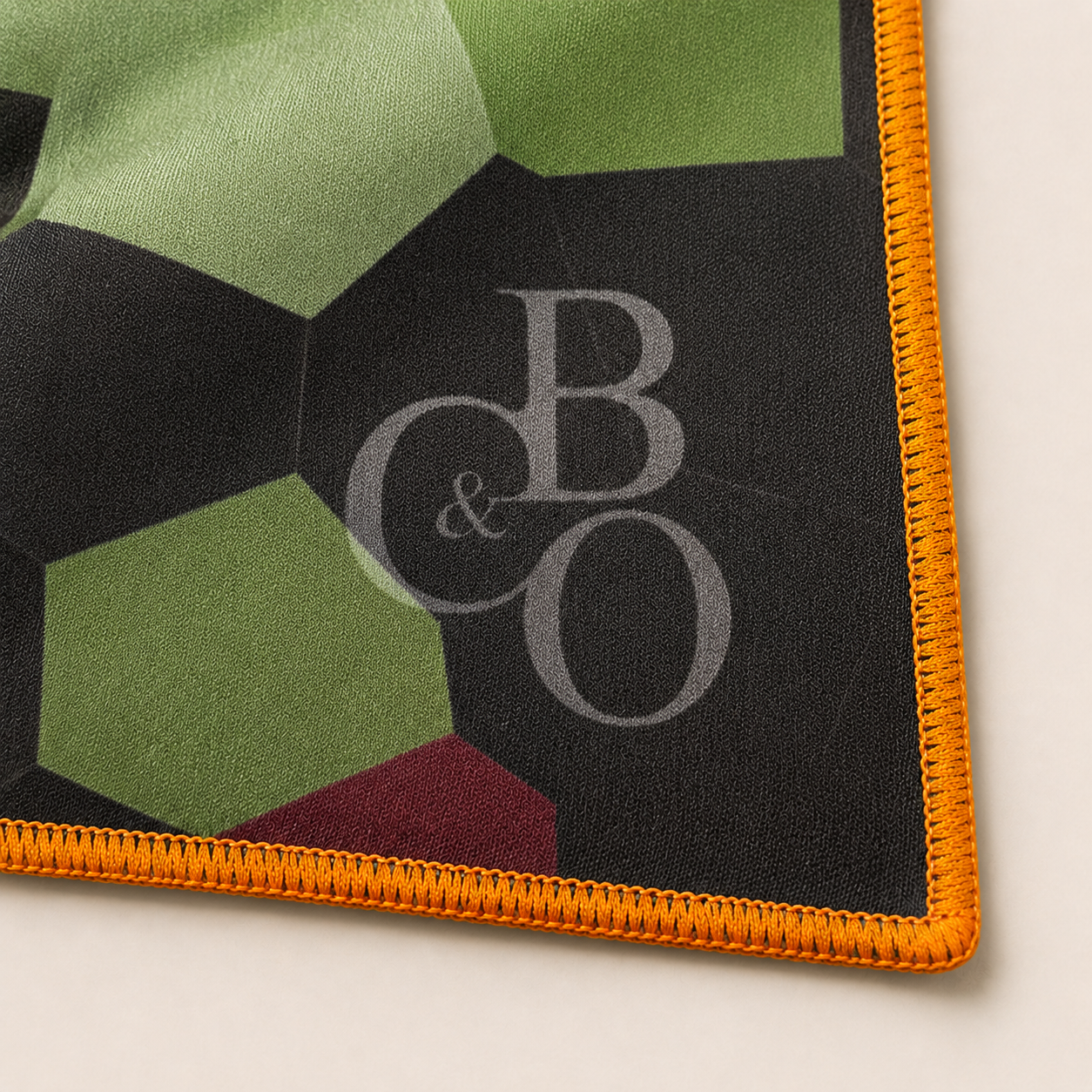 Optical-grade microfibre and stitched-edge detail