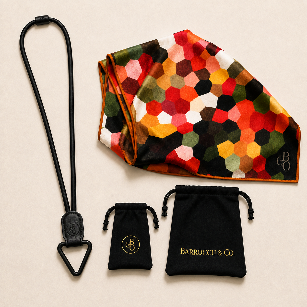The Signature Eyewear Necklace beside an oversized optical-grade microfibre cloth and included storage pouches