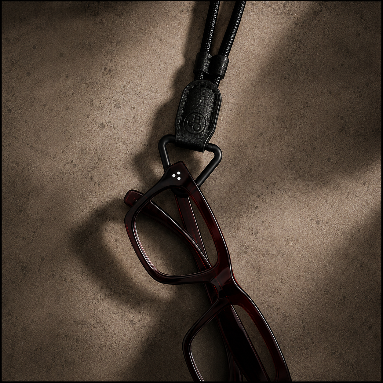 The Signature Eyewear Necklace – Black Glasses Holder Necklace with triangular loop and adjustable cord.