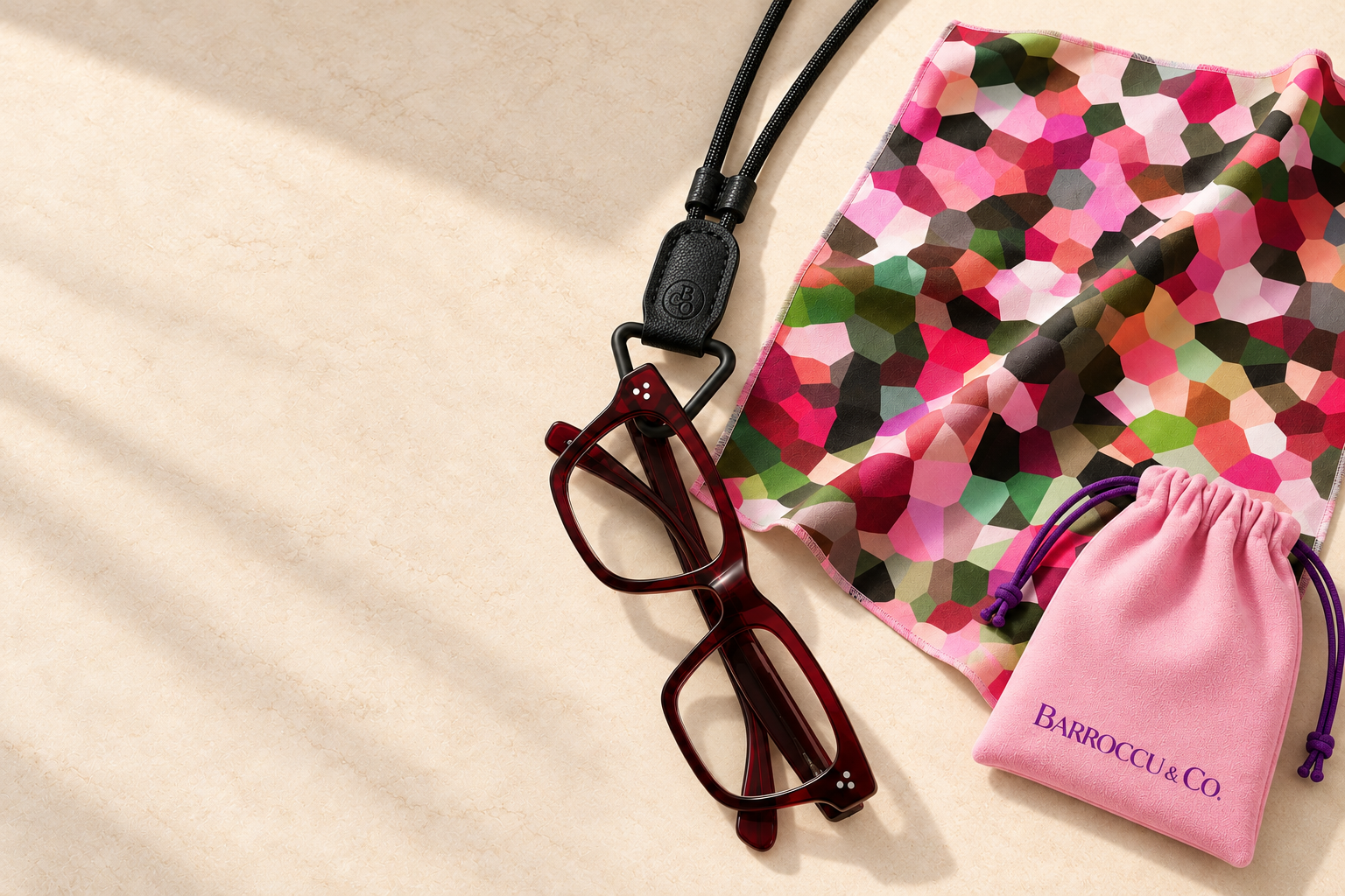 Barroccu and Co Signature eyewear necklace with glasses, oversized patterned cloth and pink storage pouch